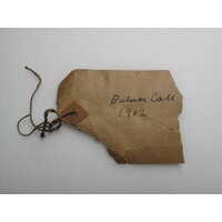 Paper label tied to object