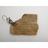 Paper label tied to object (detail 1)