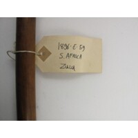 Rectangular brown paper label tied to object