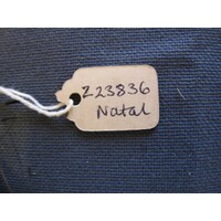 Oval paper label tied to object