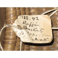 Parchment label tied to object
