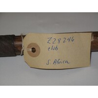 Rectangular brown paper label tied to object (view 2)